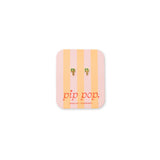 Enamel and gold palm tree stud earrings on earring card