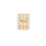 Pair of gold hoop earrings on a striped card with 'pip pop' branding.