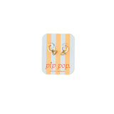 Pair of gold hoop earrings on a striped card with 'pip pop' branding.