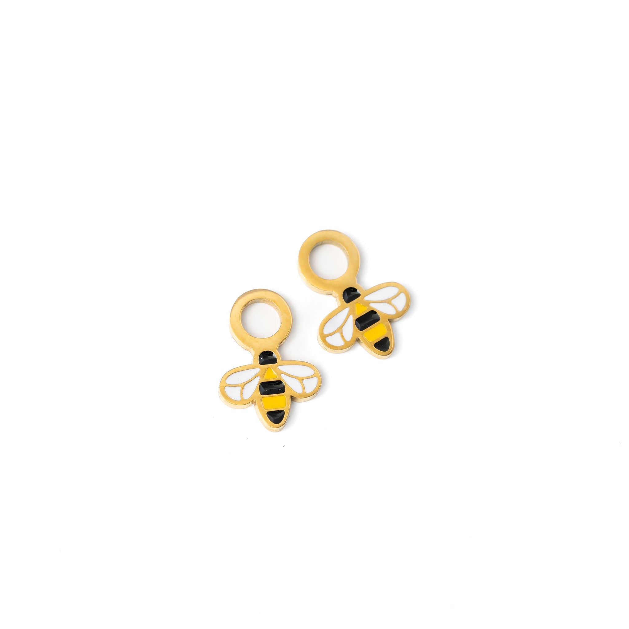 Pair of bee-shaped earrings on a white background