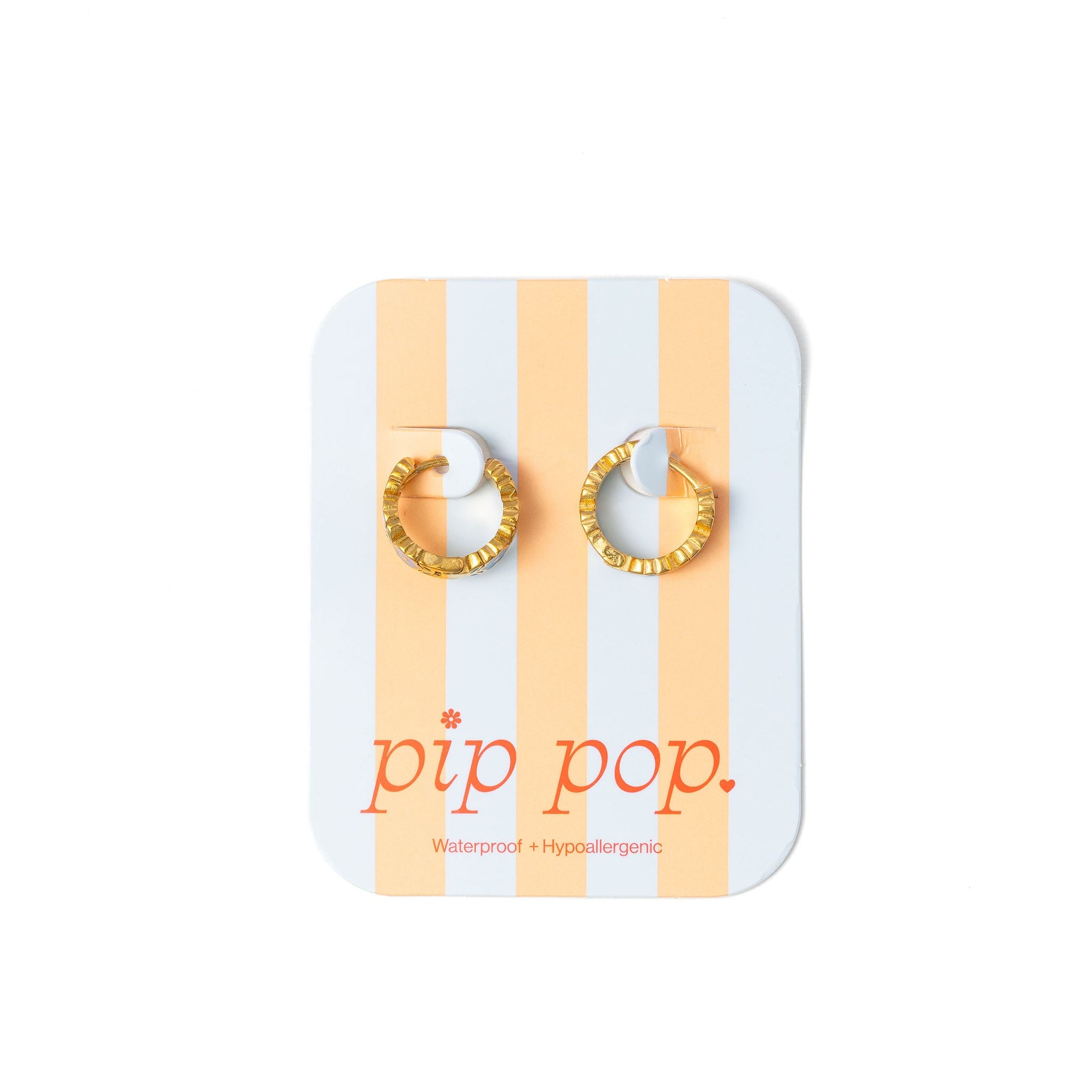 Gold hoop earrings on a striped card with 'pip pop' branding.