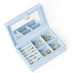 Blue jewelry box with stud earrings and hoops