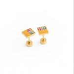 Colorful crayon box earring on a white background