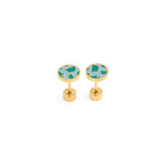 Pair of gold planet earth earrings with green blue enamel on a white background