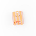 Yellow and white striped product with 'pip pop' branding on a white background
