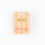 Pair of earrings on a striped card with 'pip pop' branding on a white background