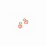 Two shell-shaped charm earrings on a white background