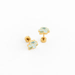 Pair of gold earrings with blue and green floral designs on a white background