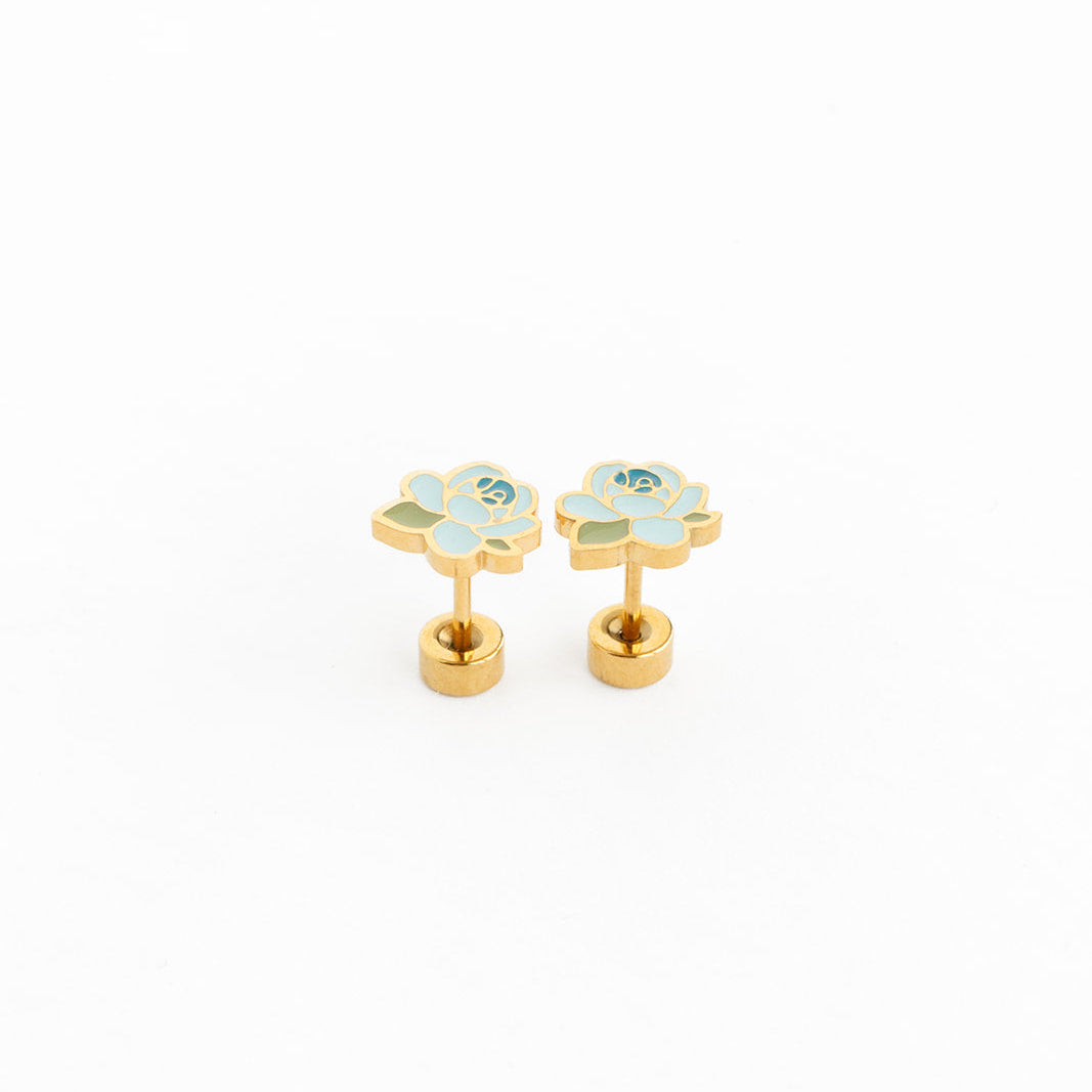 Pair of gold flower-shaped earrings with gemstones on a white background