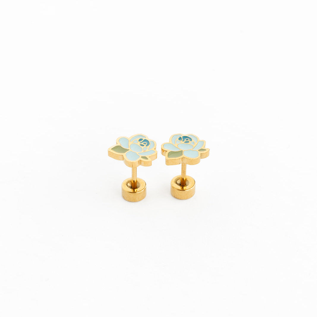Pair of gold flower-shaped earrings with gemstones on a white background