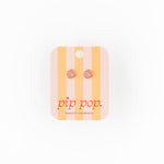 Striped product packaging with 'pip pop' branding on a white background