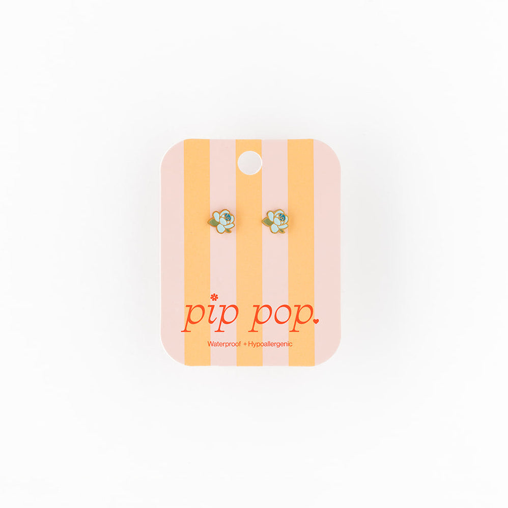 Earring card with earrings on a white background, featuring the brand 'pip pop'.